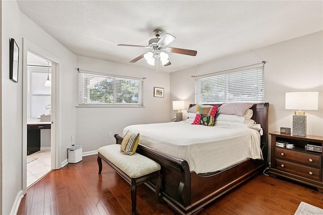 1109 Andrews Ave, Metairie, LA 70005 - bedroom featuring hardwood / wood-style flooring, a ceiling fan, and connected bathroom