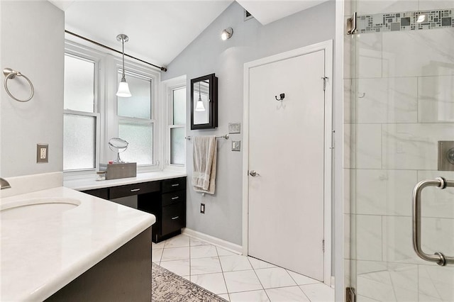1109 Andrews Ave, Metairie, LA 70005 - bathroom featuring vanity, a shower stall, vaulted ceiling, and marble look tile flooring