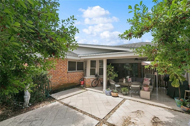 1109 Andrews Ave, Metairie, LA 70005 - rear view of property featuring roof with shingles, brick siding, and a patio