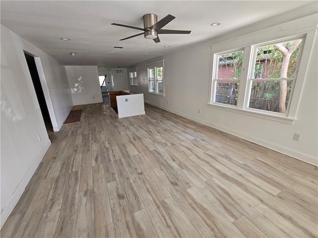 1310 Mazant St, New Orleans, LA 70117 - unfurnished living room with light wood-type flooring, a ceiling fan, and recessed lighting