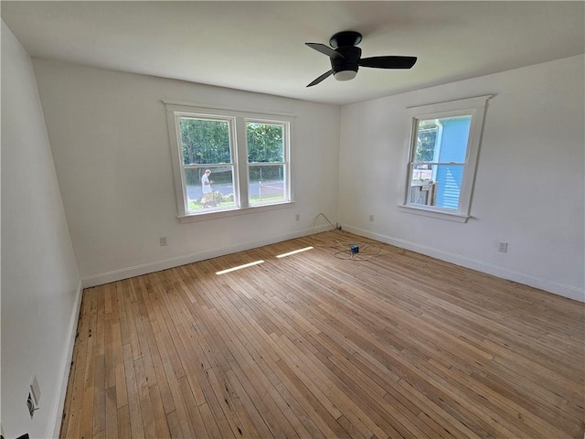 1310 Mazant St, New Orleans, LA 70117 - spare room featuring healthy amount of natural light, light wood-style flooring, and ceiling fan