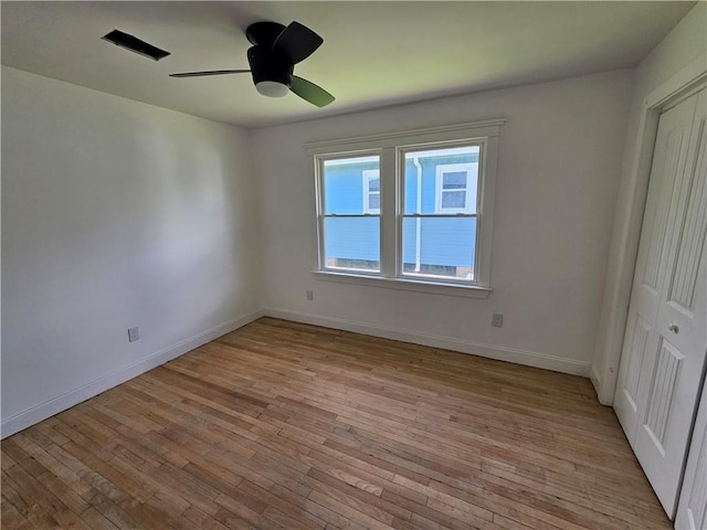 1310 Mazant St, New Orleans, LA 70117 - unfurnished bedroom featuring light wood finished floors, ceiling fan, and a closet