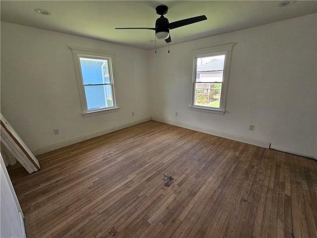 1310 Mazant St, New Orleans, LA 70117 - empty room featuring healthy amount of natural light, hardwood / wood-style flooring, and a ceiling fan