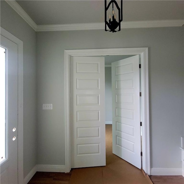 901 Dandelion Dr, Waggaman, LA 70094 - unfurnished bedroom featuring ornamental molding, a chandelier, and dark wood-style floors