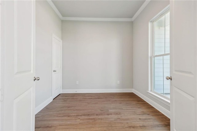 901 Dandelion Dr, Waggaman, LA 70094 - spare room with crown molding and light wood-style floors
