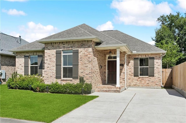1217 N Starrett Rd, Metairie, LA 70003 - view of front of property featuring roof with shingles and brick siding