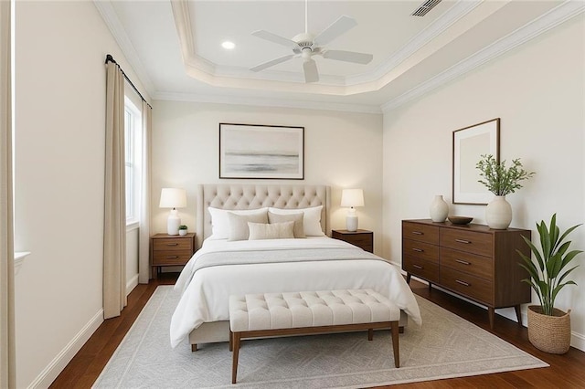 1217 N Starrett Rd, Metairie, LA 70003 - bedroom featuring dark wood-style flooring, ornamental molding, ceiling fan, recessed lighting, and a raised ceiling