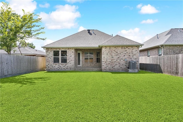 1217 N Starrett Rd, Metairie, LA 70003 - rear view of house featuring brick siding, a fenced backyard, and a shingled roof