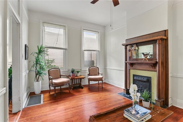 1203 Constantinople St Unit 1, New Orleans, LA 70115 - sitting room featuring wood finished floors, a fireplace with flush hearth, and a ceiling fan