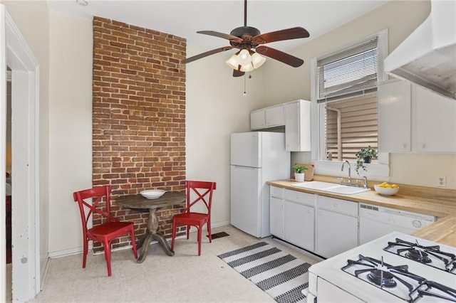 1203 Constantinople St Unit 1, New Orleans, LA 70115 - kitchen with light flooring, range hood, a ceiling fan, white appliances, and white cabinetry