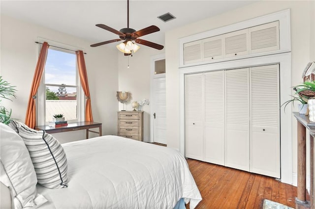 1203 Constantinople St Unit 1, New Orleans, LA 70115 - bedroom featuring wood-type flooring, a closet, and a ceiling fan
