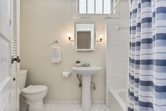 1203 Constantinople St Unit 1, New Orleans, LA 70115 - full bath with shower / bath combo and tile patterned flooring