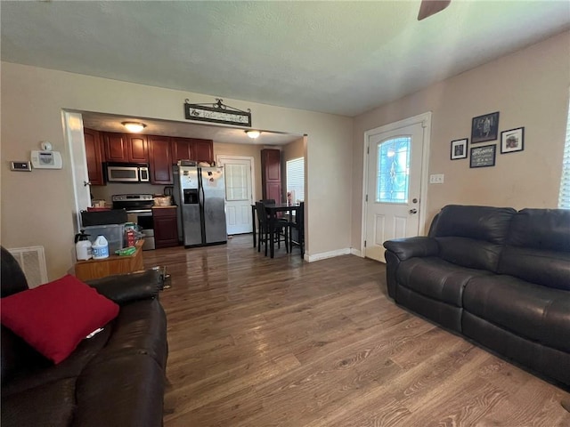 3204 Claire Ave, Gretna, LA 70053 - living room with dark wood-type flooring and ceiling fan
