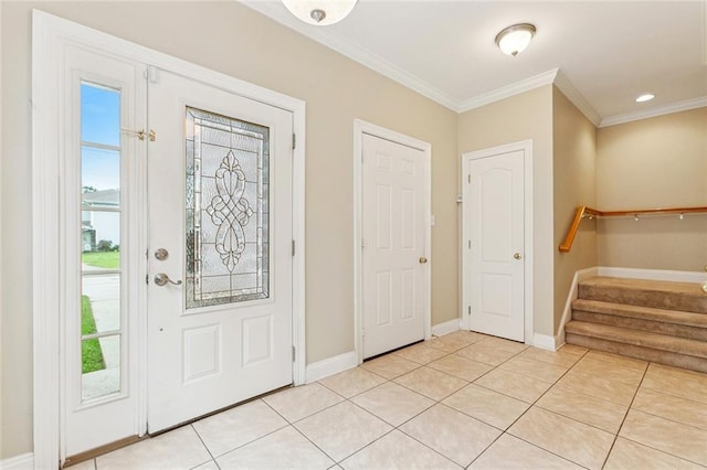 4339 Anthony St, Metairie, LA 70001 - entryway with crown molding, stairs, and light tile patterned flooring