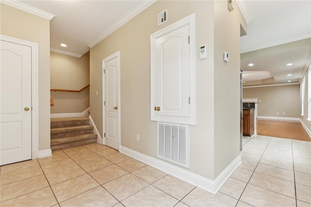 4339 Anthony St, Metairie, LA 70001 - corridor with light tile patterned floors, crown molding, recessed lighting, and stairs