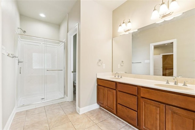 4339 Anthony St, Metairie, LA 70001 - bathroom with double vanity, tile patterned floors, and a stall shower