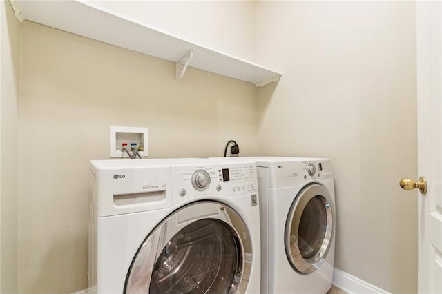 4339 Anthony St, Metairie, LA 70001 - washroom featuring baseboards and washer and dryer
