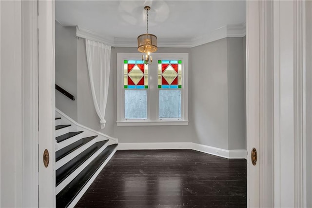 5349 Prytania St, New Orleans, LA 70115 - entrance foyer featuring dark wood-type flooring, stairway, and crown molding