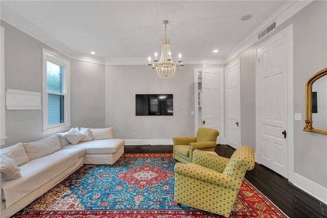 5349 Prytania St, New Orleans, LA 70115 - living room featuring dark wood-type flooring, a chandelier, ornamental molding, and recessed lighting