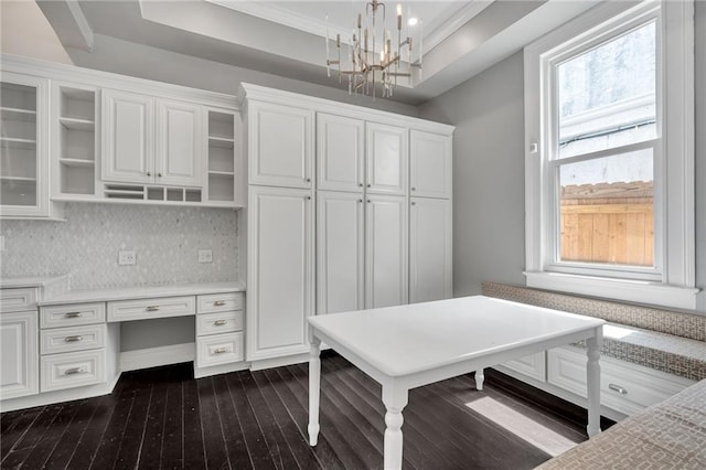 5349 Prytania St, New Orleans, LA 70115 - office space featuring dark wood finished floors, a chandelier, built in desk, ornamental molding, and a raised ceiling