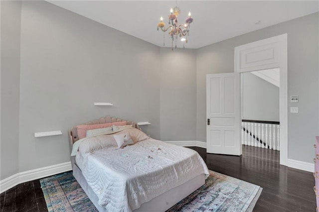 5349 Prytania St, New Orleans, LA 70115 - bedroom featuring wood finished floors and a chandelier