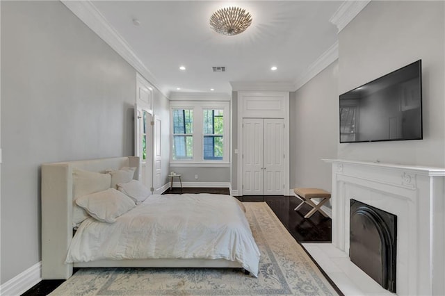 5349 Prytania St, New Orleans, LA 70115 - bedroom with ornamental molding, recessed lighting, light wood finished floors, and a fireplace with flush hearth