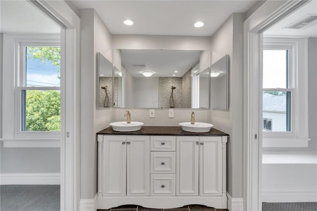 5349 Prytania St, New Orleans, LA 70115 - full bathroom featuring double vanity and a shower