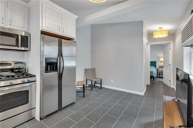 5349 Prytania St, New Orleans, LA 70115 - kitchen with appliances with stainless steel finishes and white cabinetry