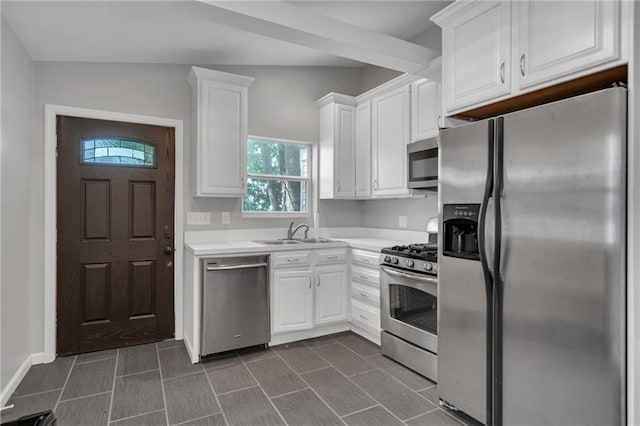 5349 Prytania St, New Orleans, LA 70115 - kitchen featuring stainless steel appliances, white cabinetry, and light countertops