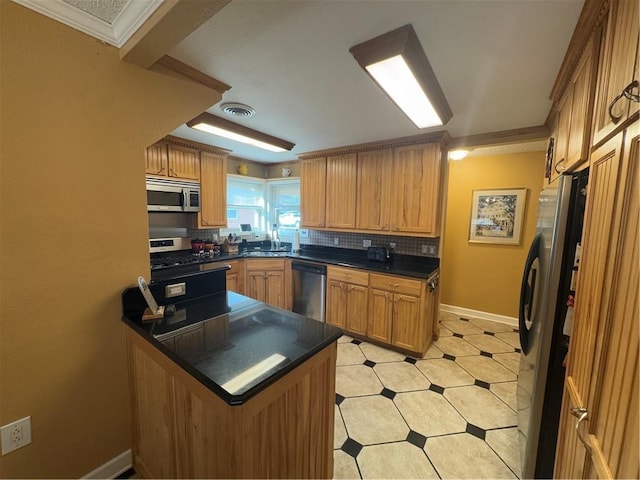 1620 Kent Ave, Metairie, LA 70001 - kitchen featuring dark countertops, appliances with stainless steel finishes, a peninsula, crown molding, and tasteful backsplash