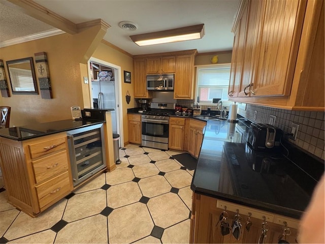 1620 Kent Ave, Metairie, LA 70001 - kitchen with crown molding, stainless steel appliances, beverage cooler, tasteful backsplash, and dark countertops