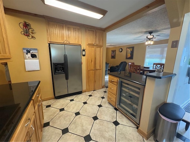 1620 Kent Ave, Metairie, LA 70001 - kitchen with dark countertops, stainless steel fridge with ice dispenser, beverage cooler, ceiling fan, and a peninsula