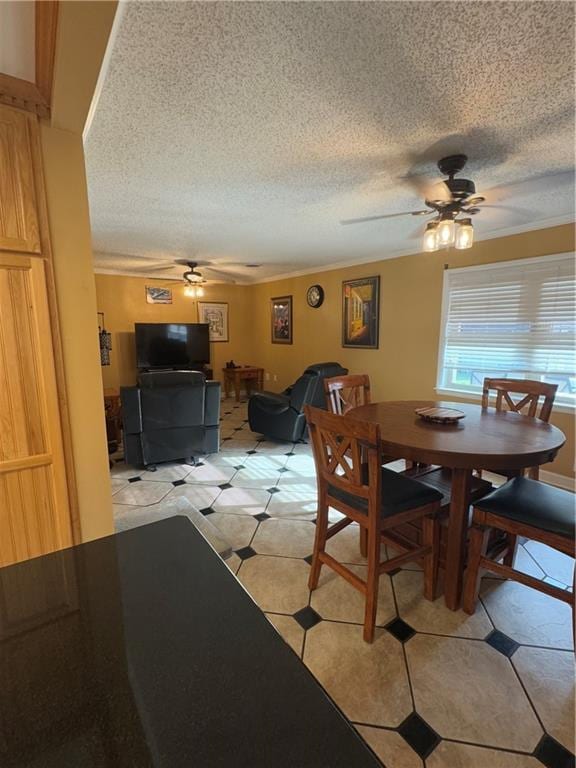1620 Kent Ave, Metairie, LA 70001 - dining room featuring ceiling fan, a textured ceiling, and crown molding