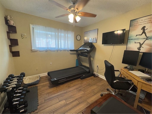 1620 Kent Ave, Metairie, LA 70001 - exercise room featuring wood finished floors, ceiling fan, and a textured ceiling
