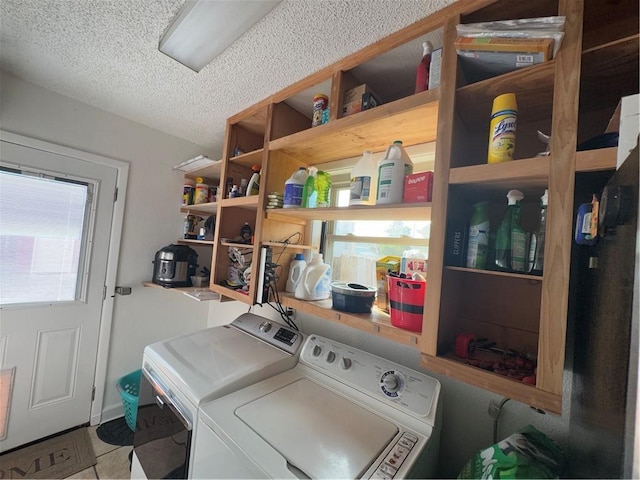 1620 Kent Ave, Metairie, LA 70001 - washroom with washing machine and clothes dryer, a textured ceiling, and tile patterned floors