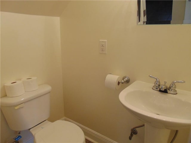 bathroom with toilet and sink