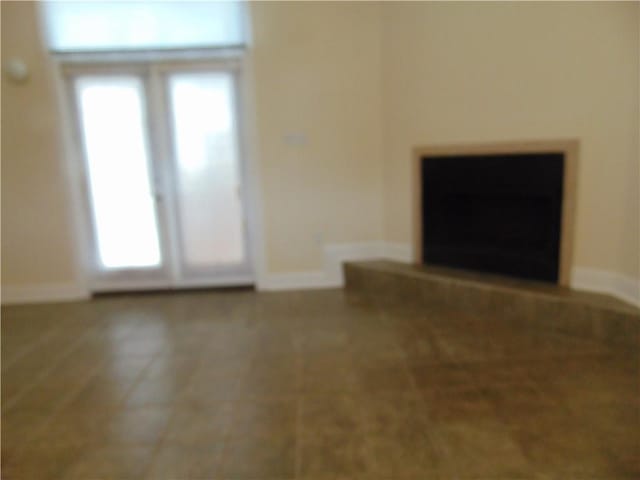 unfurnished living room featuring plenty of natural light