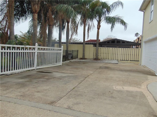 view of patio / terrace featuring a garage