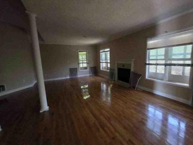 315 Bentwood Ln, Columbia, SC 29229 - unfurnished living room featuring baseboards, a fireplace, and wood finished floors