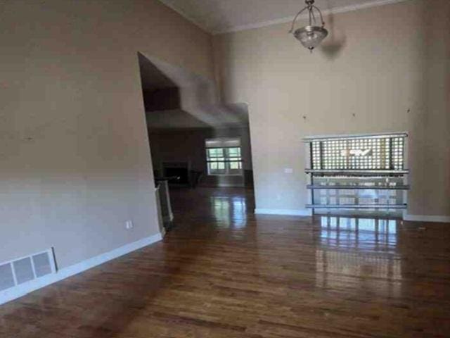 315 Bentwood Ln, Columbia, SC 29229 - unfurnished living room featuring baseboards, wood finished floors, and ornamental molding