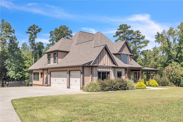 view of front of house featuring an attached garage, a front lawn, concrete driveway, and roof with shingles