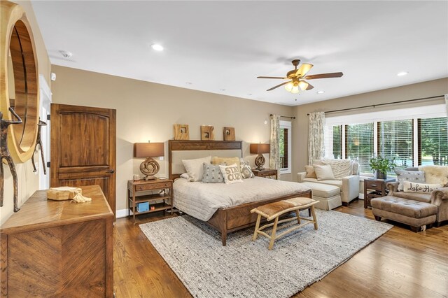 bedroom with recessed lighting, dark wood-style flooring, and ceiling fan