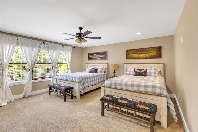 bedroom with recessed lighting, ceiling fan, baseboards, and light colored carpet