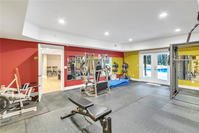 exercise room with recessed lighting, french doors, and baseboards