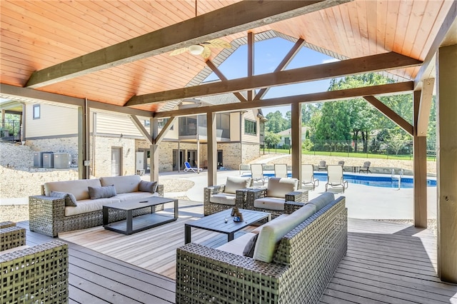 wooden terrace featuring central AC, an outdoor pool, and an outdoor hangout area