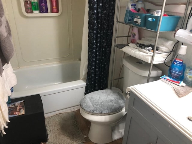 full bathroom featuring vanity, shower / tub combo, and toilet