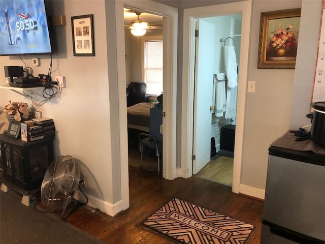 hallway featuring dark wood-type flooring