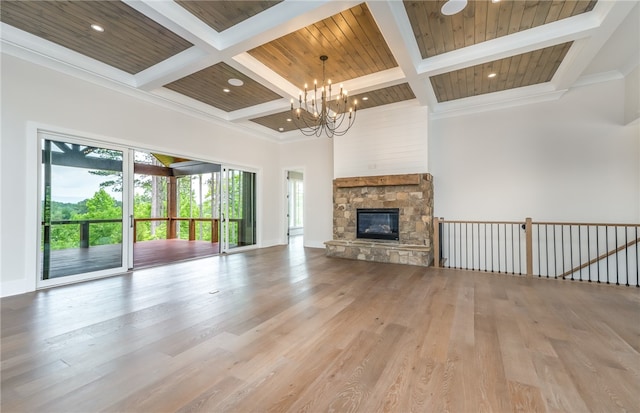 unfurnished living room featuring wooden ceiling, a chandelier, and light wood-type flooring