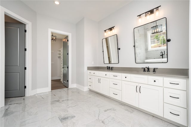 bathroom featuring a bathing tub and vanity