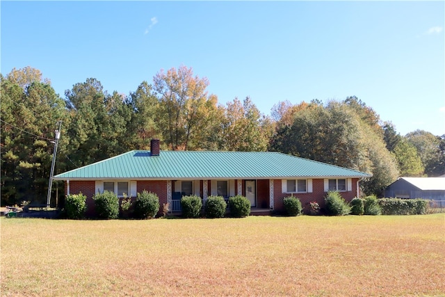 ranch-style house with a front lawn